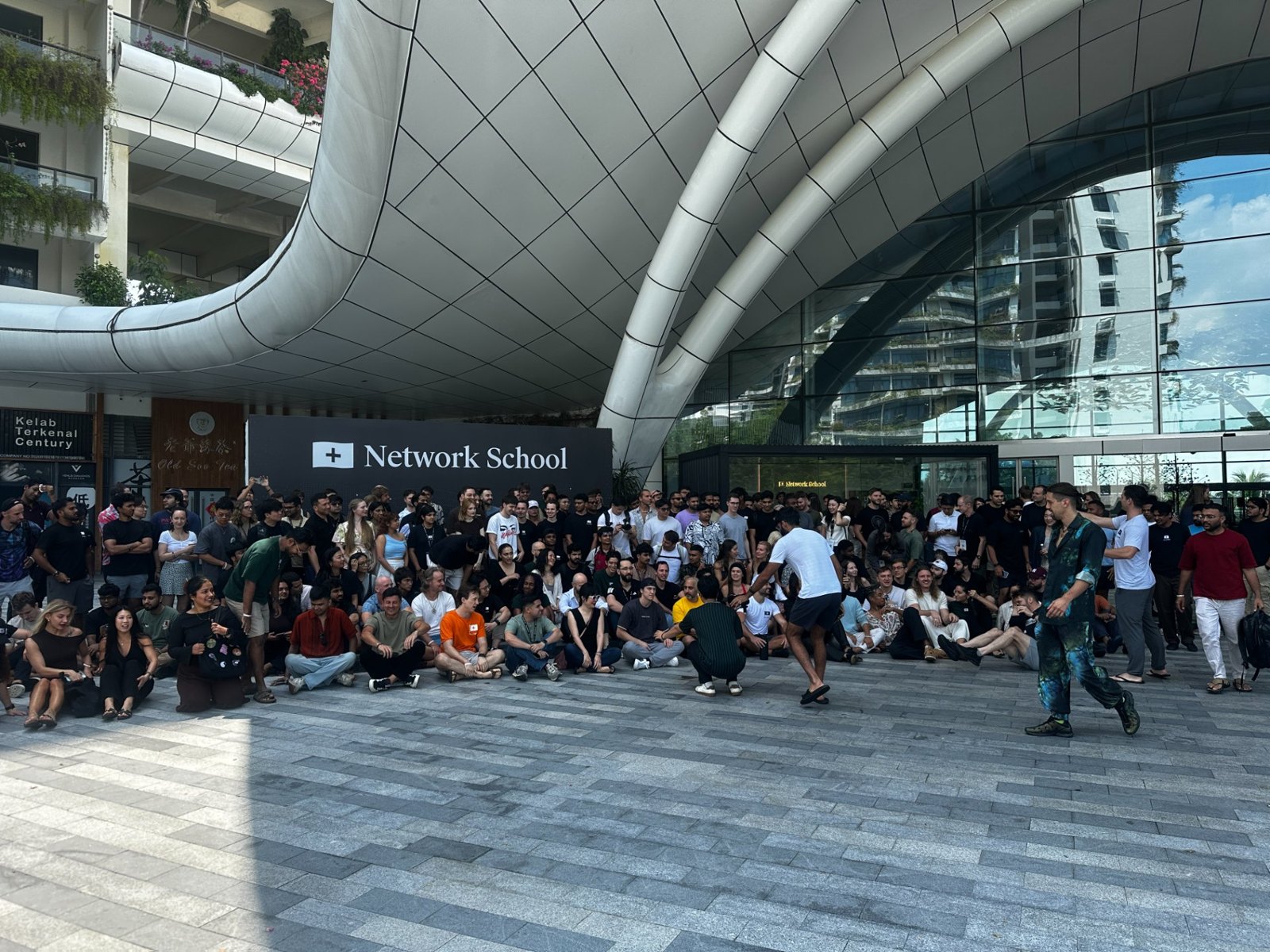 Hundreds of builders gathered outside the Network School building in Forest City