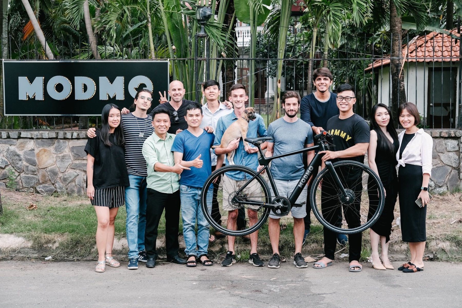 The Modmo team at the villa-HQ gates in Ho Chi Minh City