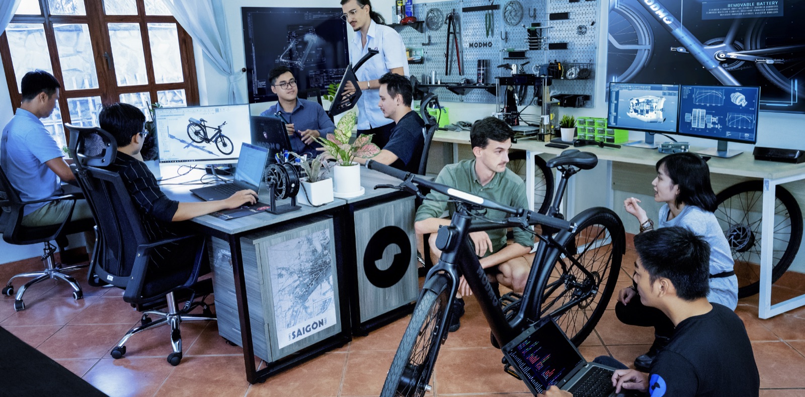 The Modmo studio in Ho Chi Minh City — the team working among prototype ebikes